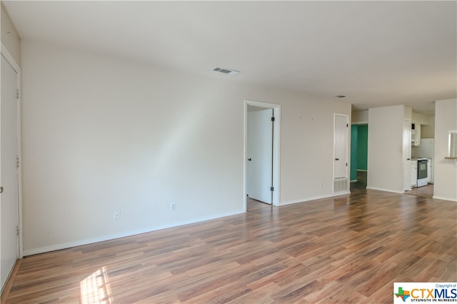 unfurnished living room featuring hardwood / wood-style floors