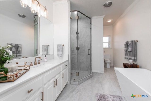 full bathroom with vanity, tile patterned floors, crown molding, toilet, and independent shower and bath