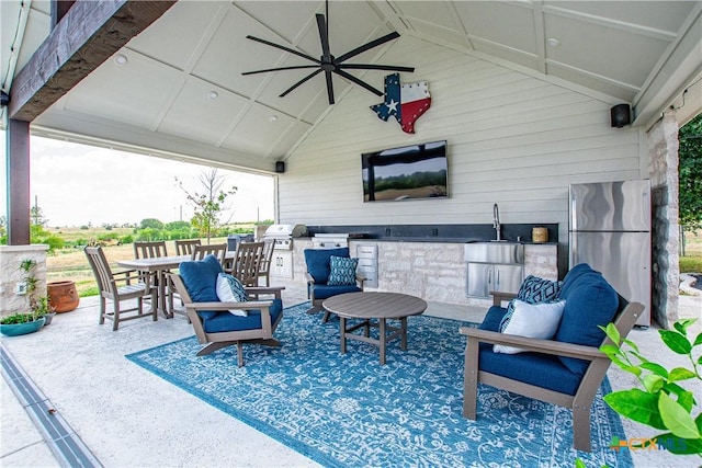 view of patio featuring area for grilling, sink, and grilling area