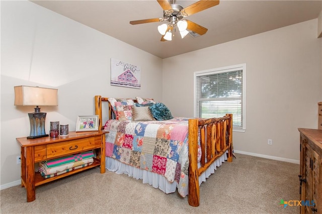 bedroom with ceiling fan and light colored carpet