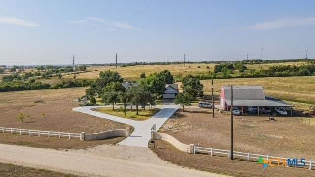 birds eye view of property featuring a rural view