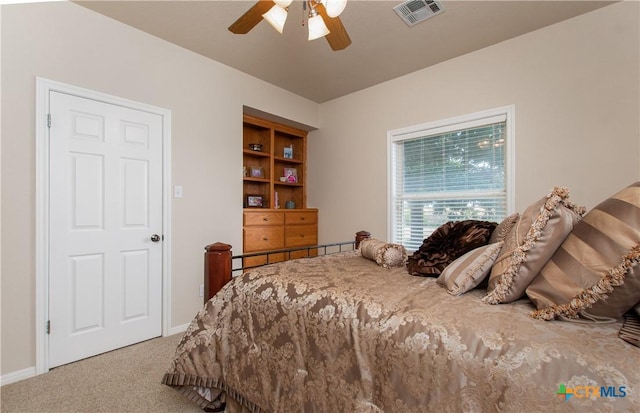 carpeted bedroom with ceiling fan