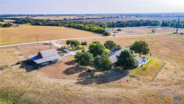 birds eye view of property with a rural view