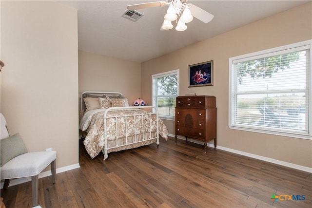 bedroom featuring dark hardwood / wood-style flooring and ceiling fan