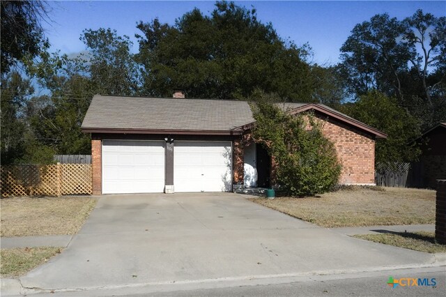 single story home with a garage