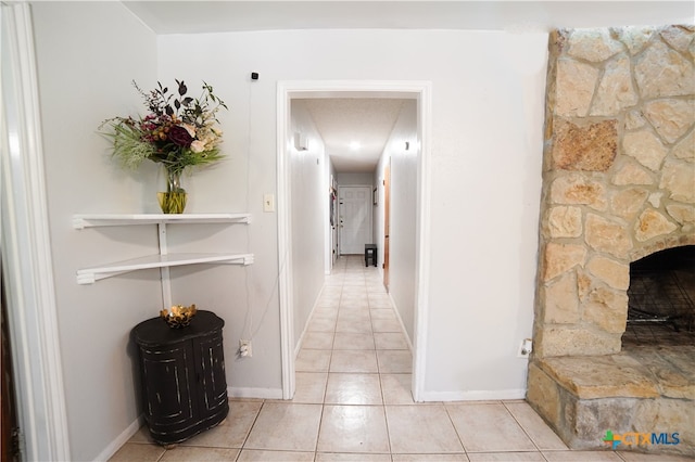 corridor with light tile patterned floors