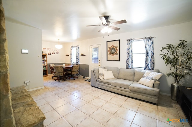 tiled living room with ceiling fan