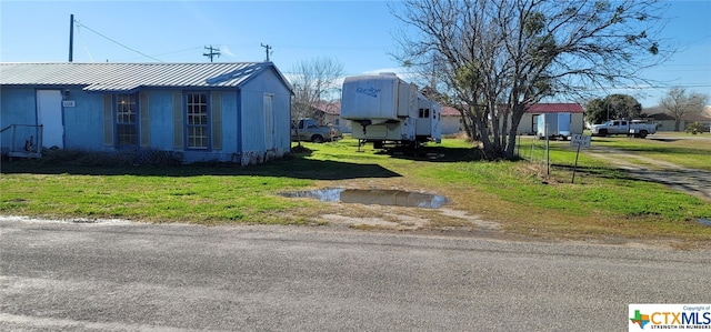 view of home's exterior featuring a lawn