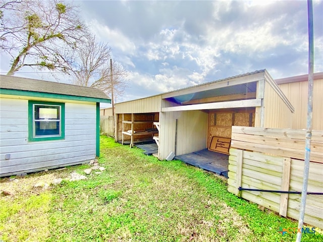 back of property with an outbuilding