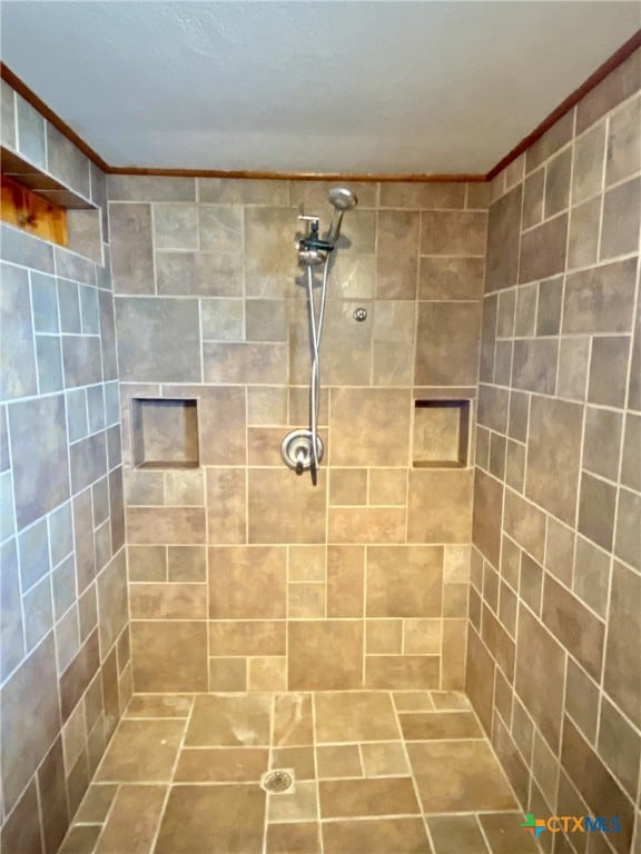 full bathroom with tiled shower