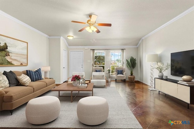 living room with dark tile patterned floors, ceiling fan, and crown molding