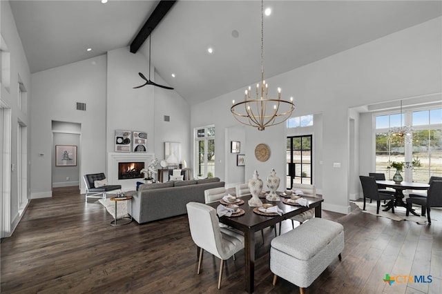 dining space featuring dark hardwood / wood-style flooring, plenty of natural light, high vaulted ceiling, and beamed ceiling