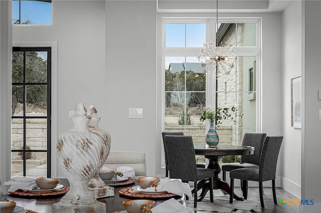 dining area featuring an inviting chandelier