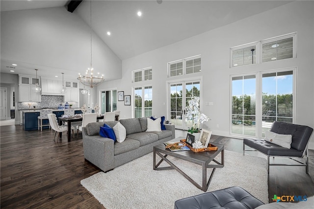 living room with beamed ceiling, high vaulted ceiling, dark hardwood / wood-style floors, and an inviting chandelier