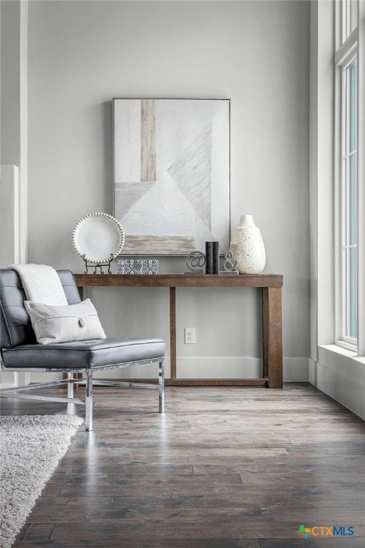 living area with hardwood / wood-style flooring