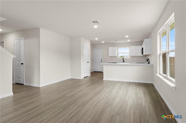 3816 Poteet Ct, Temple, TX 76504 - unfurnished living room with light wood-style flooring and recessed lighting