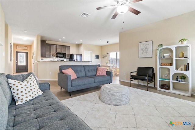 living room with ceiling fan