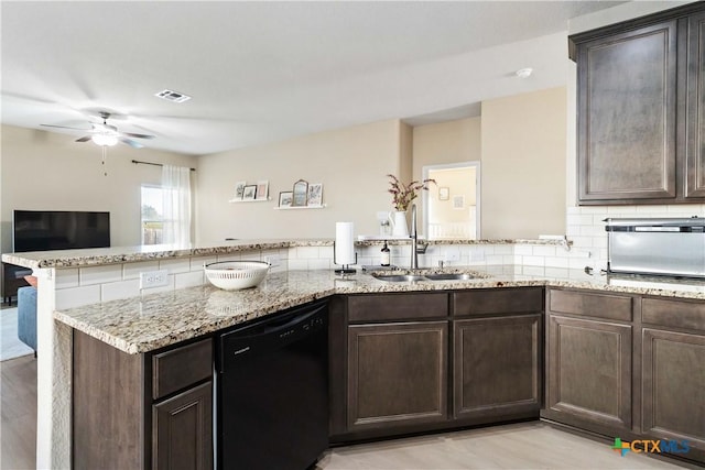 kitchen featuring kitchen peninsula, dishwasher, dark brown cabinets, and sink