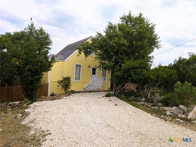 127 Forest Mist, Canyon Lake, TX 78133 - view of front of home with fence and gravel driveway