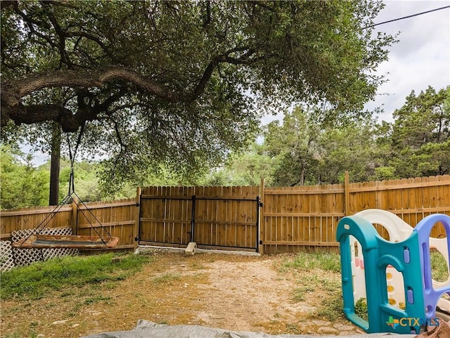 127 Forest Mist, Canyon Lake, TX 78133 - view of yard featuring a gate and fence