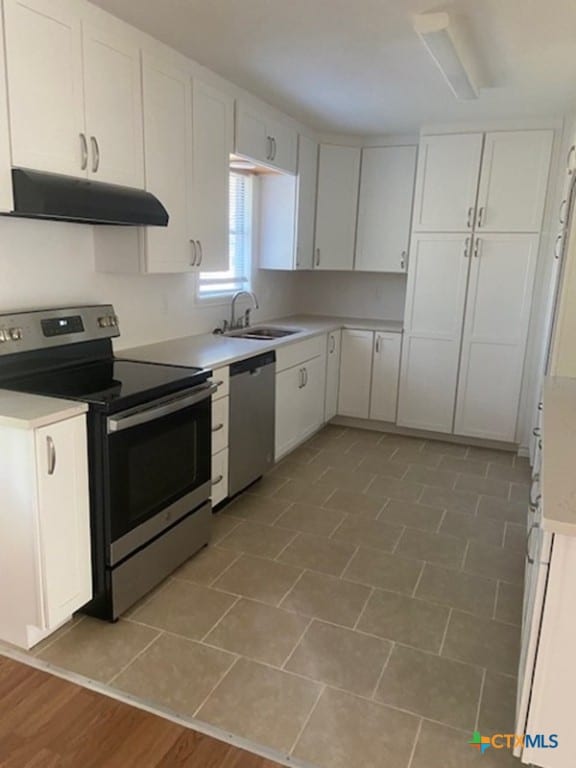 kitchen with white cabinets, sink, and stainless steel appliances