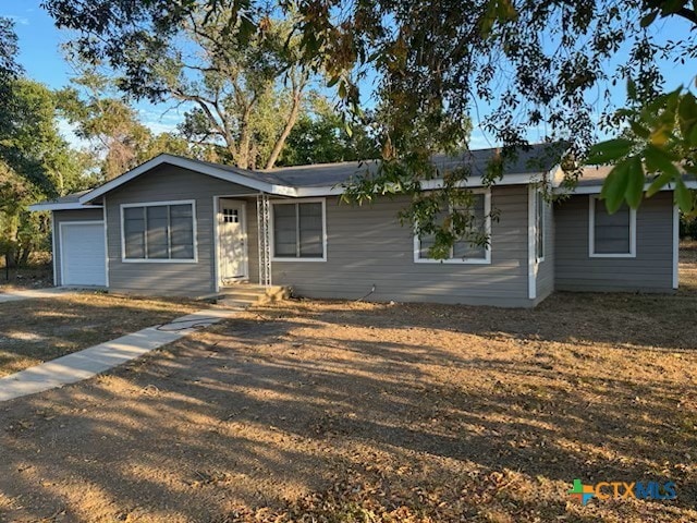 single story home featuring a garage