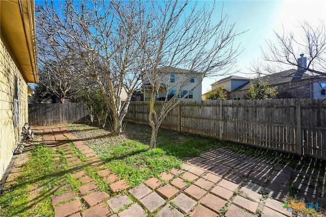 fenced backyard with a patio area