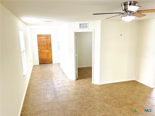 spare room featuring ceiling fan