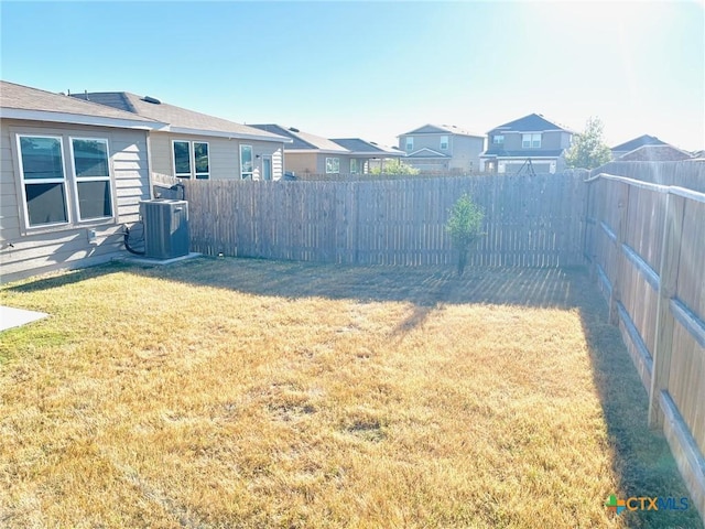 view of yard featuring central AC unit