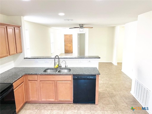 kitchen with stove, dark stone counters, sink, ceiling fan, and black dishwasher