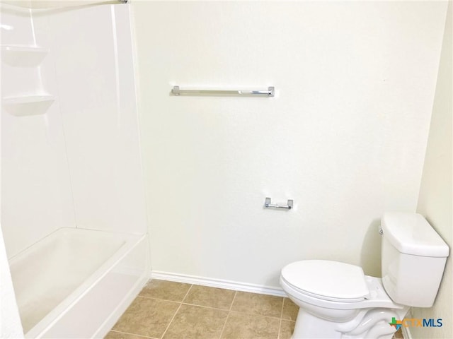 bathroom with tile patterned floors and toilet