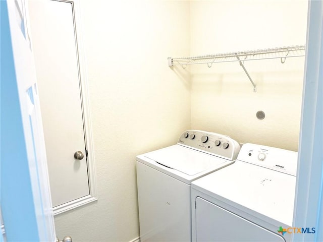 laundry room with separate washer and dryer