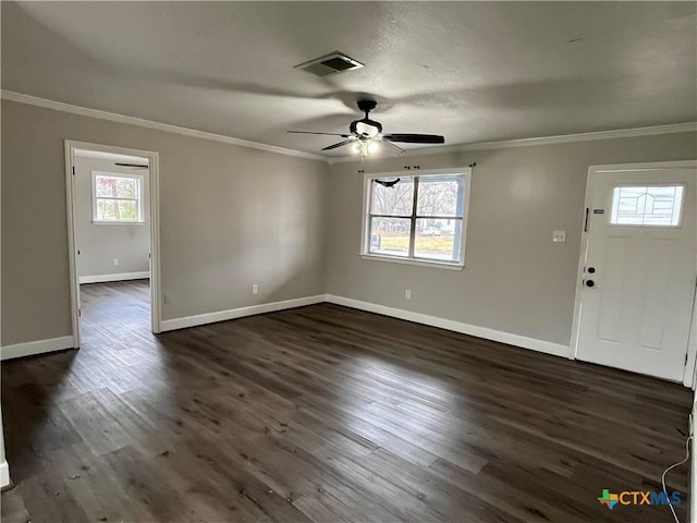 entrance foyer with crown molding, plenty of natural light, and dark hardwood / wood-style floors