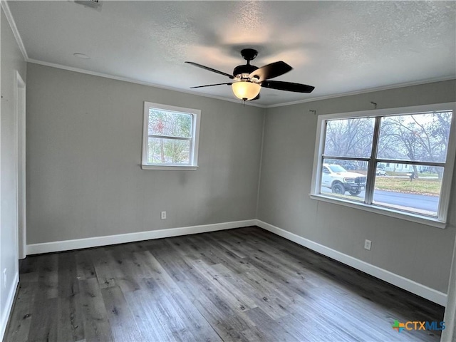 empty room with ceiling fan, dark hardwood / wood-style flooring, a textured ceiling, and ornamental molding