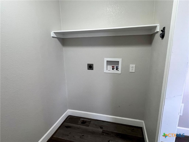 clothes washing area with hookup for an electric dryer, hookup for a washing machine, and wood-type flooring