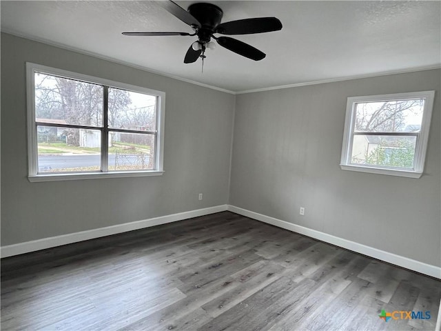 unfurnished room featuring a textured ceiling, ceiling fan, crown molding, and dark hardwood / wood-style floors