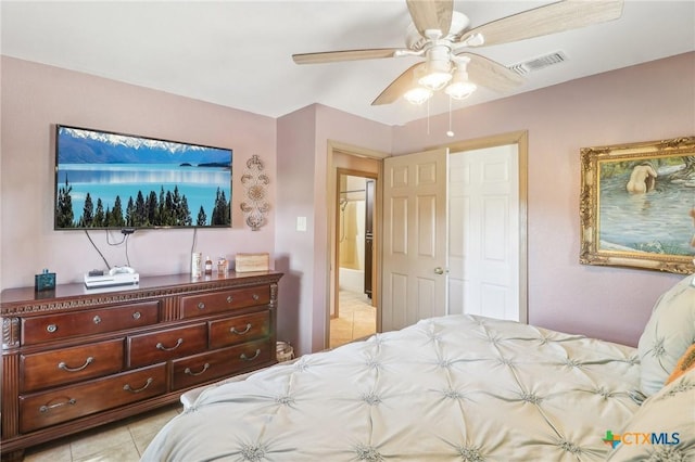 103 Misty Bnd, Floresville, TX 78114 - bedroom with light tile patterned floors, visible vents, and ceiling fan