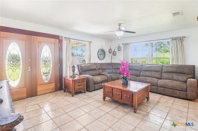 103 Misty Bnd, Floresville, TX 78114 - living room with visible vents, light tile patterned flooring, and ceiling fan