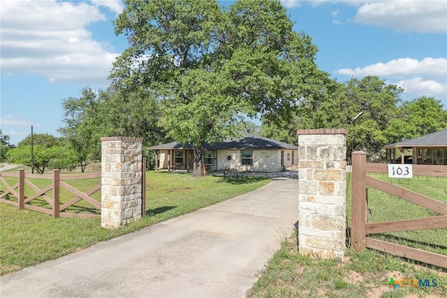 103 Misty Bnd, Floresville, TX 78114 - view of front of property featuring concrete driveway, fence, and a front yard