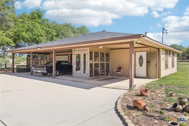 103 Misty Bnd, Floresville, TX 78114 - exterior space featuring french doors, fence, and an attached carport