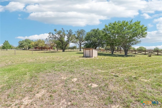 103 Misty Bnd, Floresville, TX 78114 - view of yard featuring a storage unit, fence, and an outdoor structure