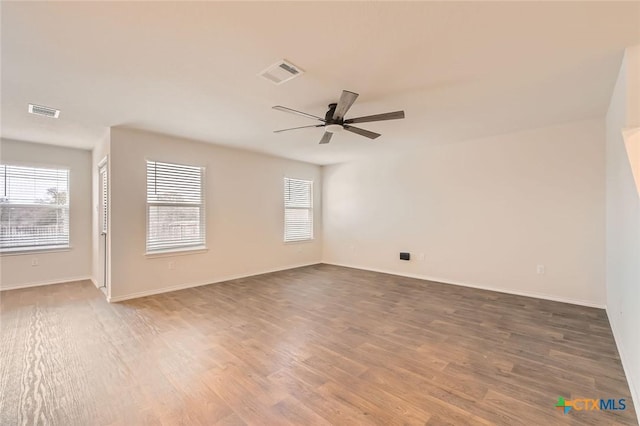 12039 Kettle Riv, San Antonio, TX 78245 - spare room featuring a ceiling fan, healthy amount of natural light, and wood finished floors