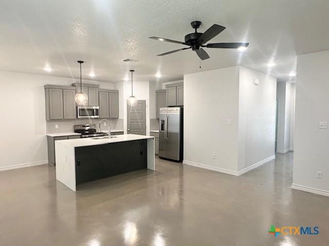 kitchen featuring light countertops, gray cabinets, concrete floors, appliances with stainless steel finishes, and ceiling fan