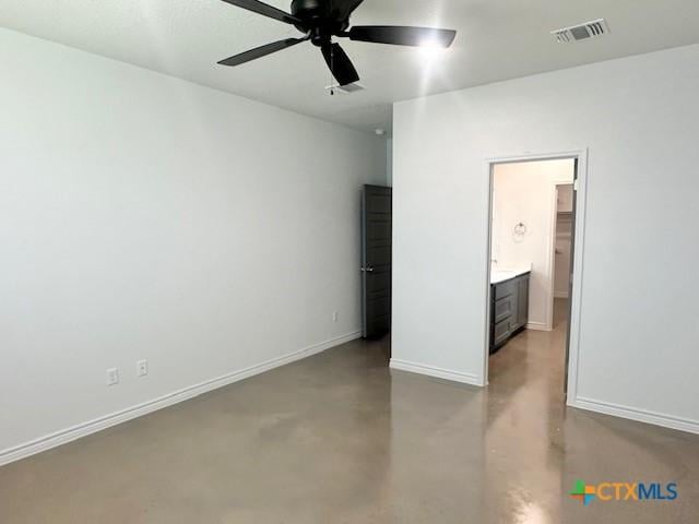 unfurnished bedroom with visible vents, finished concrete flooring, baseboards, and a ceiling fan