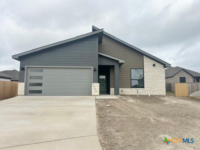 unfinished property featuring a garage