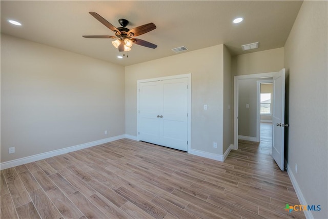 unfurnished bedroom with visible vents, recessed lighting, baseboards, and light wood-style floors