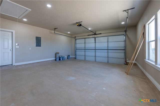 garage featuring electric panel, baseboards, a garage door opener, and recessed lighting