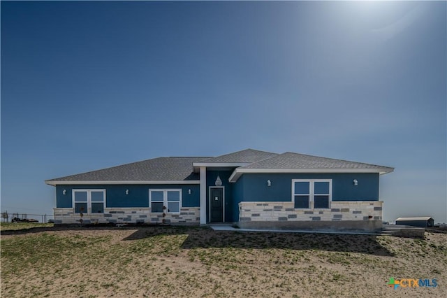 view of front of house with stone siding and stucco siding