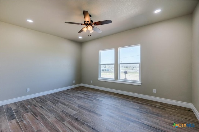 empty room featuring recessed lighting, ceiling fan, baseboards, and dark wood-style flooring