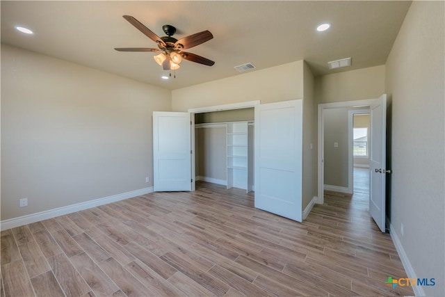 unfurnished bedroom with recessed lighting, visible vents, baseboards, and light wood-style flooring